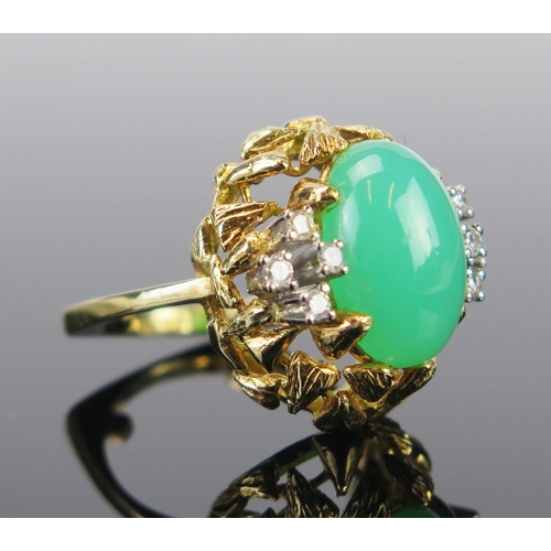 94 - An 18ct Gold, Chrysoprase and Diamond Dress Ring, the 14x9x5mm central cabochon stone surrounded by ... 