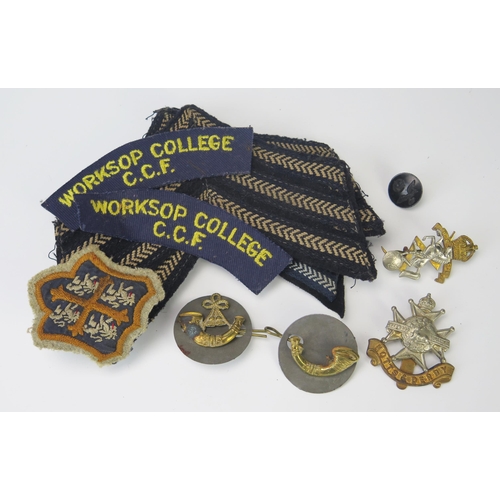 941 - A collection of cloth Sargeants stripes, CCF shoulder badges, and various other cap badges.