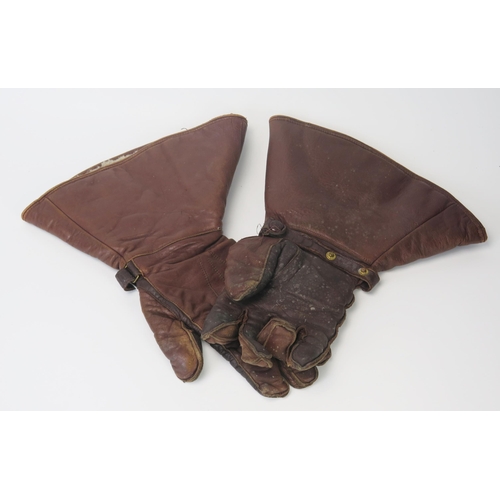 949 - A pair of WWI pattern brown leather flying gloves with lined interiors.