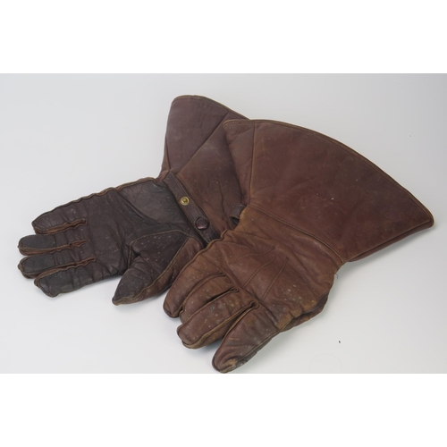 949 - A pair of WWI pattern brown leather flying gloves with lined interiors.