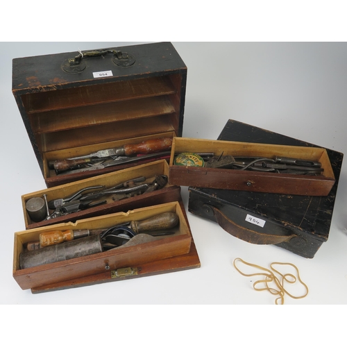 954 - Two painted wood War Department style tool boxes, containing assorted tools and accessories.