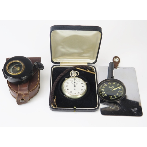 962 - A military style compass in stitched leather case, a steel cased stopwatch, together with an America... 