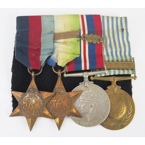 979 - A World War II group of four, includes 1939-45 Star, Atlantic  Star with France Germany clasp, War M... 