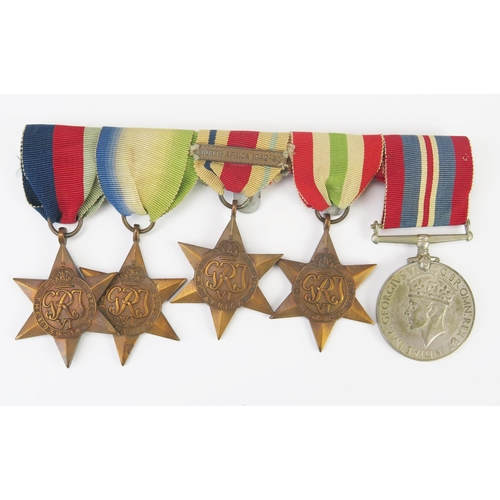 983 - A World War II group of five medals, includes, 1939-45 Star, Africa Star with clasp, Atlantic Star, ... 