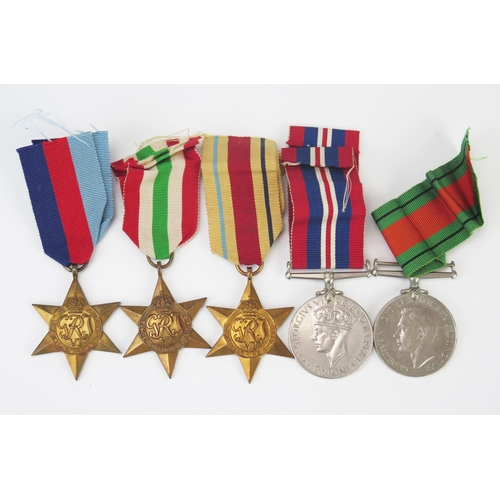 987 - A World War II group of five medals, includes, 1939-45 Star, Africa Star, Italy Star, War and Defenc... 