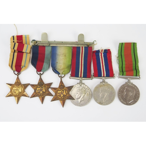 989 - A World War II trio, includes War Medal 1939-45 Star, and Atlantic Star, together with An Africa Sta... 