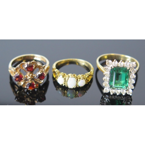 99 - A 9ct Gold and Garnet Ring (full Birmingham hallmarks, 14mm head, size K.5, 3g), a 9ct gold and opal... 