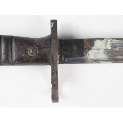 991A - A World War I American issue bayonet, with 43cm fullered blade, stamped marks, with ribbed wood slab... 