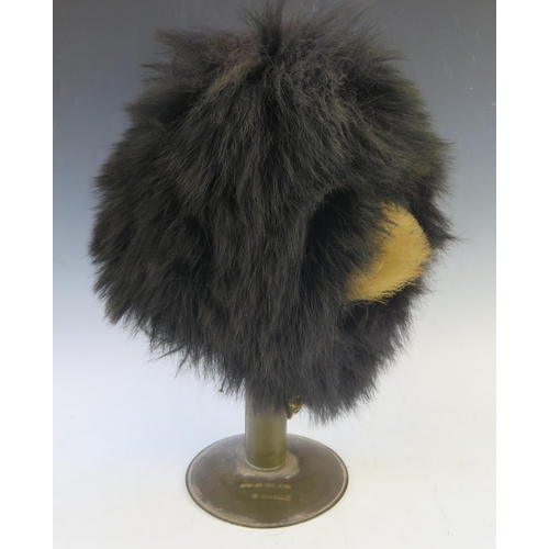 998 - A Grenadier guards bearskin, with white plume, with brass chin strap,