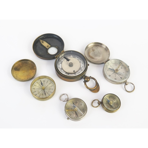 1075 - A brass cased military style compass and four others