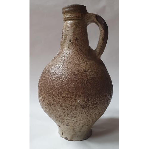 1260 - A 17th century Bellermine bottle, of ovoid form with traditional bearded mask decoration to the neck... 