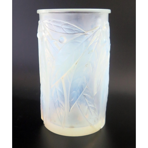 1290 - A Lalique opalescent glass 'Leaf & Berry' pattern vase.  Signed R Lalique, France close to the base,... 