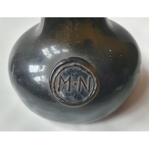 1299 - An 18th century green glass onion-shaped wine bottle, bears seal 'MN', 13cm tall,