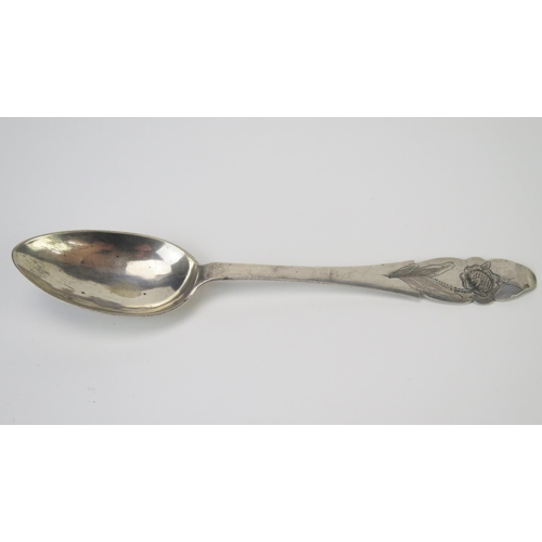 673 - An early 19th century German silver spoon, maker IR, Norden, Germany, initialled, with floral chased... 