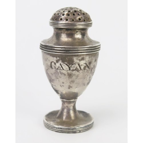 680 - An Indian silver cayenne shaker, initialled, of urn-shaped outline, with pierced dome lift-off lid, ... 