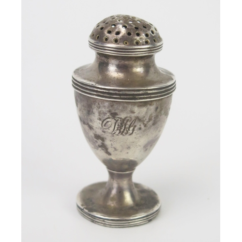 680 - An Indian silver cayenne shaker, initialled, of urn-shaped outline, with pierced dome lift-off lid, ... 