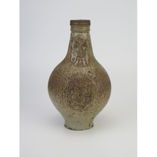 1260 - A 17th century Bellermine bottle, of ovoid form with traditional bearded mask decoration to the neck... 