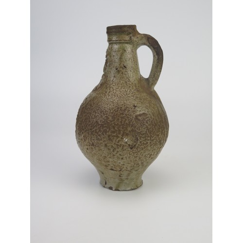 1260 - A 17th century Bellermine bottle, of ovoid form with traditional bearded mask decoration to the neck... 