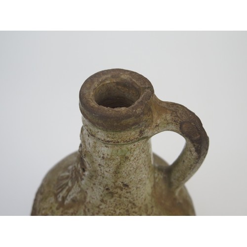 1260 - A 17th century Bellermine bottle, of ovoid form with traditional bearded mask decoration to the neck... 