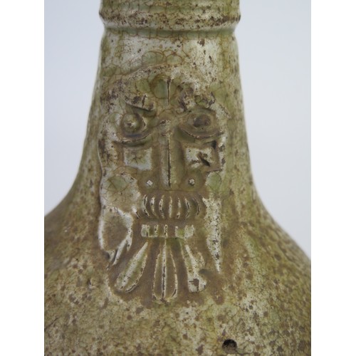 1260 - A 17th century Bellermine bottle, of ovoid form with traditional bearded mask decoration to the neck... 