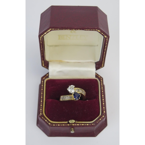 1 - A Modern 18ct Gold, Sapphire and Diamond 'Entwined Hearts' Crossover Ring, the primary stones c. 6.3... 