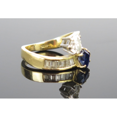 1 - A Modern 18ct Gold, Sapphire and Diamond 'Entwined Hearts' Crossover Ring, the primary stones c. 6.3... 