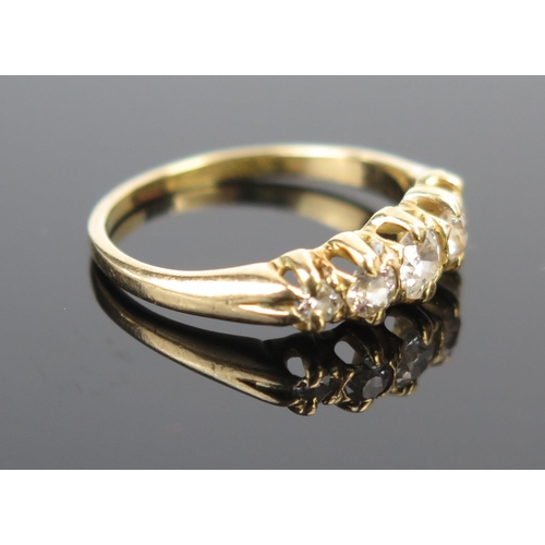 100 - A Five Stone Old Cut Diamond Ring in unmarked high carat gold setting, largest stone c. 3.9mm, size ... 