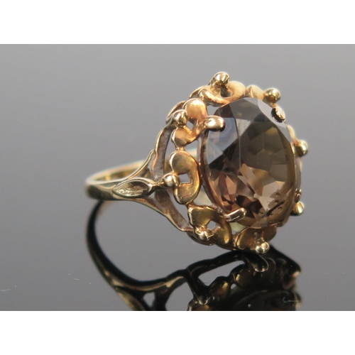 105 - A 9ct Gold and Smoky Quartz Dress Ring, full London hallmarks, size L.5, 3.7g