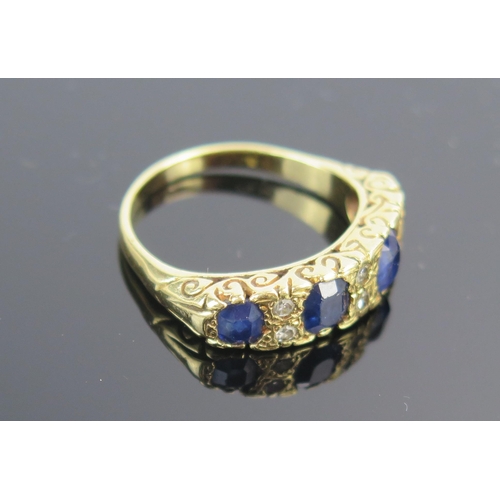 11 - An 18ct Gold, Sapphire and Diamond Ring, 6mm wide head, largest stones c. 5x4.5mm, size P.75, 7.2g