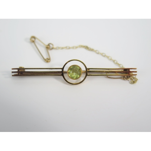 118 - A 9ct Gold Peridot Bar Brooch (50mm) and 9ct gold and paste brooch (49mm), 4.9g