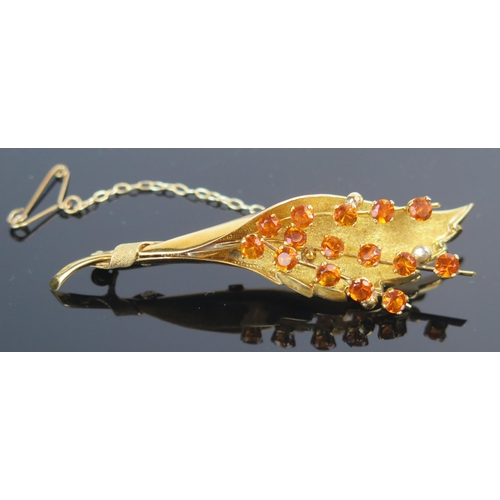 127 - An 18ct Gold and Citrine? Foliate Spray Brooch, 70mm, 13.6g and a pair of similar yellow metal earri... 