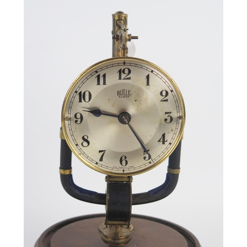 1302 - An early 20th century Boulle electric timepiece, with 9cm silvered Arabic dial, pulse pendulum, moun... 