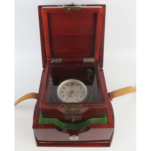 1305 - A Russian lacquered brass ships chronometer, with 9.5cm Arabic dial with subsidiary seconds dial and... 