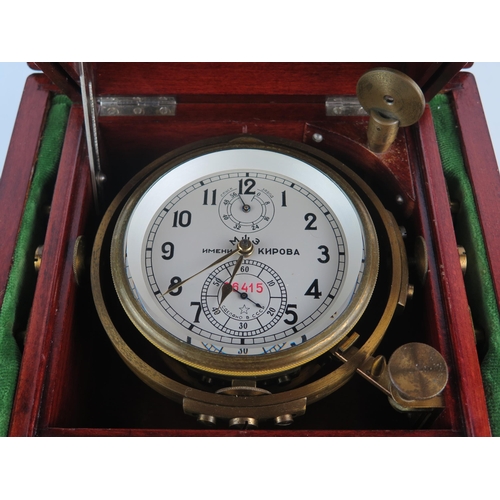 1305 - A Russian lacquered brass ships chronometer, with 9.5cm Arabic dial with subsidiary seconds dial and... 