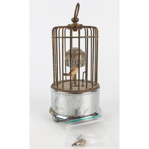 1309 - An automaton bird timepiece, with hours and minute reels, pointer and bird contained in a cage, 14cm... 