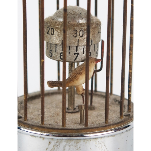 1309 - An automaton bird timepiece, with hours and minute reels, pointer and bird contained in a cage, 14cm... 