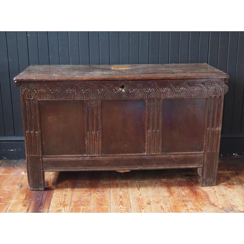 1326 - A late 17th/early 18th century oak coffer of panelled construction, the hinged lid with a moulded fr... 