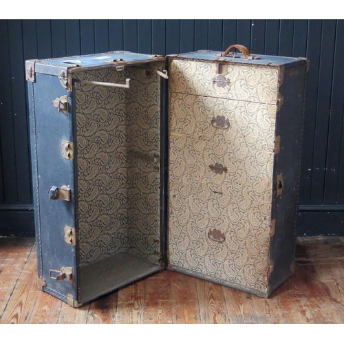 1330 - An American Hartmann metal and canvas bound steamer trunk, with two hinged doors, enclosing four fit... 