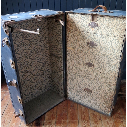 1330 - An American Hartmann metal and canvas bound steamer trunk, with two hinged doors, enclosing four fit... 