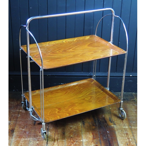 1331 - A Gerlinol chrome and teak folding two-tier tea trolley, on casters, 87cm long.