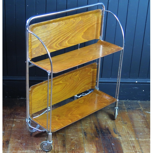 1331 - A Gerlinol chrome and teak folding two-tier tea trolley, on casters, 87cm long.