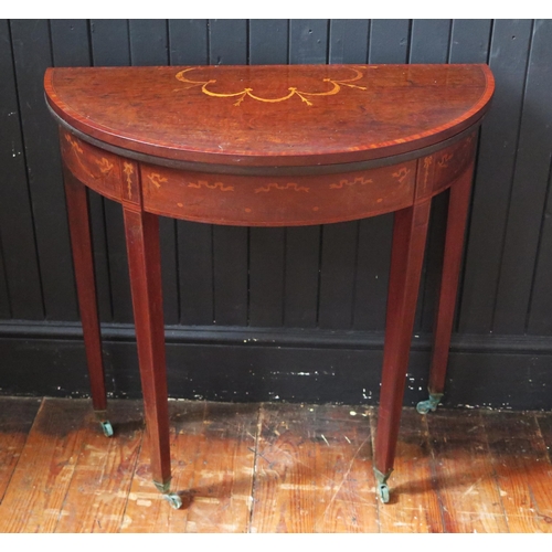 1332 - A 19th century mahogany crossbanded and inlaid demi-lune card table, the hinged top with inlaid garl... 