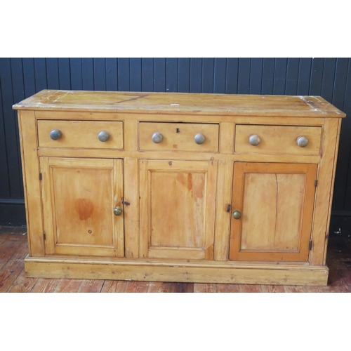 1337 - A 19th century pine dresser, the associated top with moulded cornice, above a pair of glazed panel d... 