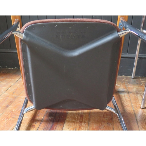 1343 - A set of four Antocks Lairn stainless steel and teak elbow chairs, with padded backs and seats, labe... 