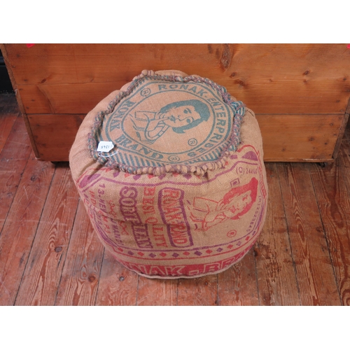 1345 - A stained wood ottoman with printed hessian padded hinged lid, 107cm long, together with a printed h... 