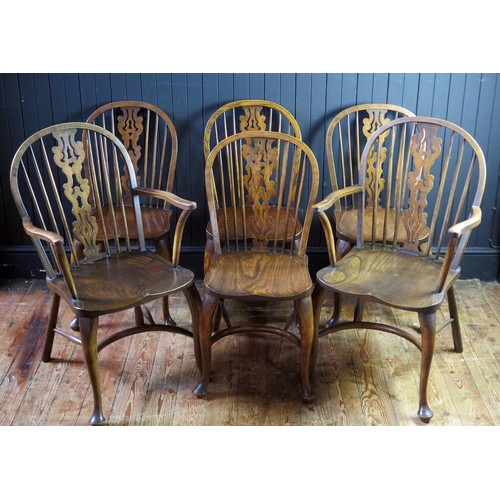 1346 - A set of six elm stick back dining chairs, with pierced central splat, solid seats on turned legs wi... 