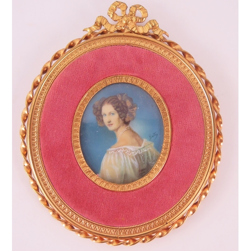 1386 - An oval miniature portrait of a young woman, in lace dress, oil on celluloid, signed Betty, containe... 