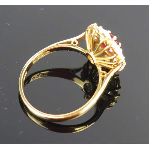 14 - A Modern 18ct Gold, Ruby and Diamond Cluster Ring, 14x13mm head, ruby c. 6.5x5.1mm, c. 3.5mm brillia... 