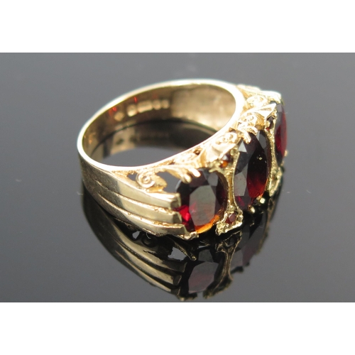 190 - A 9ct Gold and Garnet Dress Ring, c. 21x10.5mm head, full London hallmarks, size M, 4.3g.