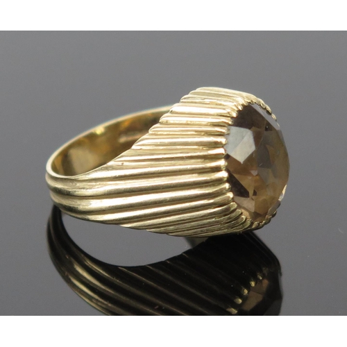 196 - A 9ct Gold and Smoky Quartz Dress Ring, c. 12x10mm stone, size K.5, 6g